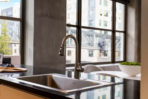 a bed room with a bed and a large window