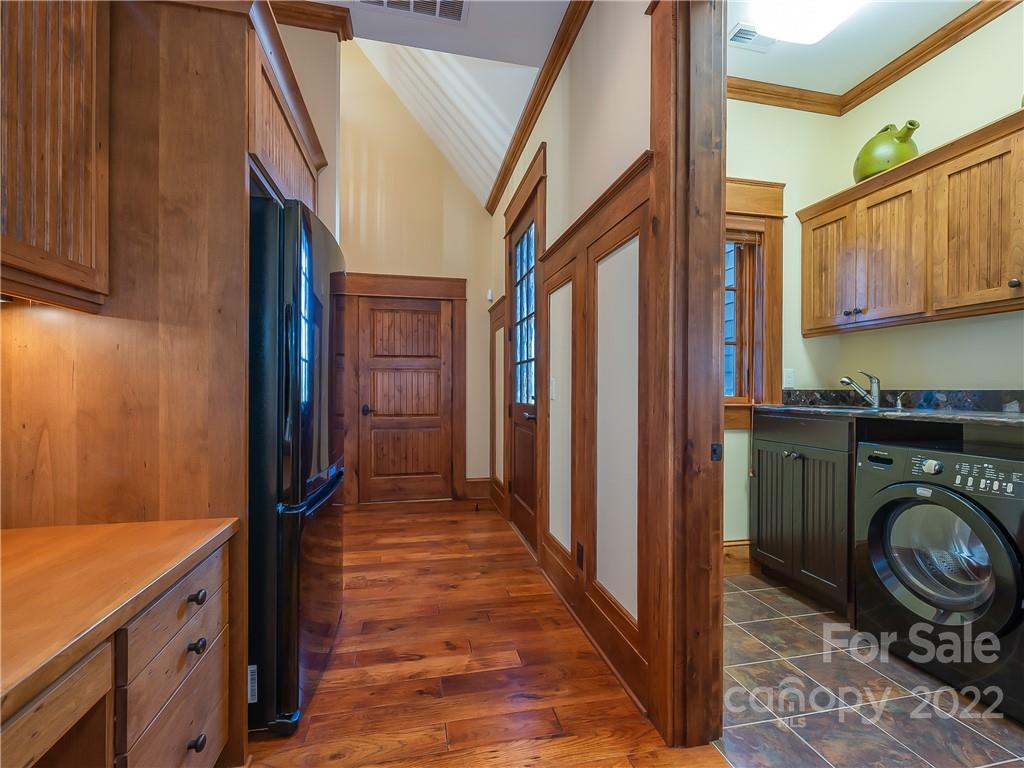 538 Chestertown Drive Mill Spring, NC 28756 - Photo 16 of 46 a view of a hallway with washer and dryer