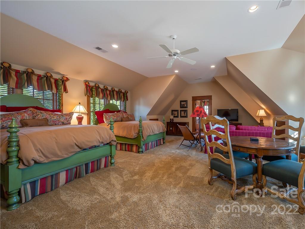 538 Chestertown Drive Mill Spring, NC 28756 - Photo 17 of 46 a living room with lots of furniture and a chandelier