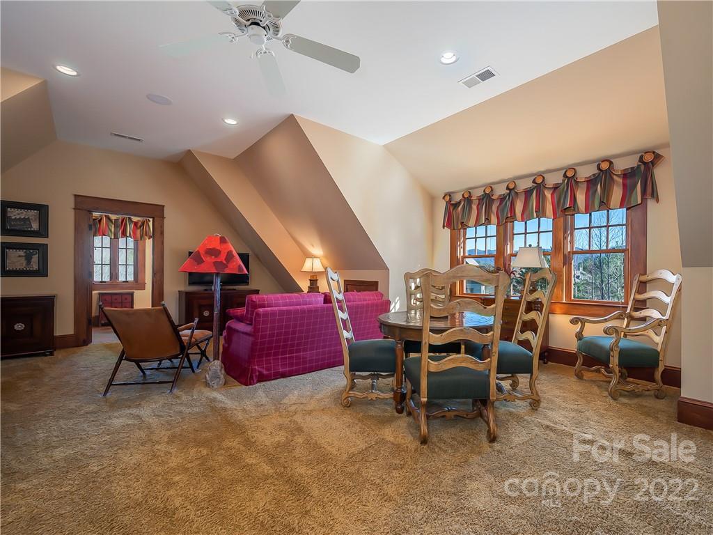 538 Chestertown Drive Mill Spring, NC 28756 - Photo 18 of 46 a living room with furniture gym equipment and a ceiling fan