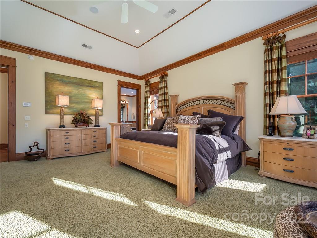 538 Chestertown Drive Mill Spring, NC 28756 - Photo 25 of 46 a bed room with a bed and a large window