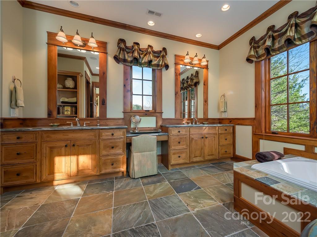 538 Chestertown Drive Mill Spring, NC 28756 - Photo 26 of 46 a bathroom with a sink a vanity and a mirror
