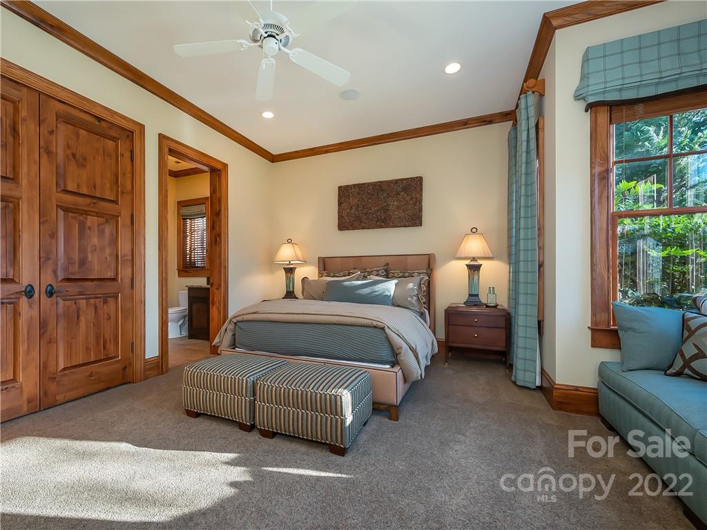 538 Chestertown Drive Mill Spring, NC 28756 - Photo 36 of 46 a spacious bedroom with a bed and a couch