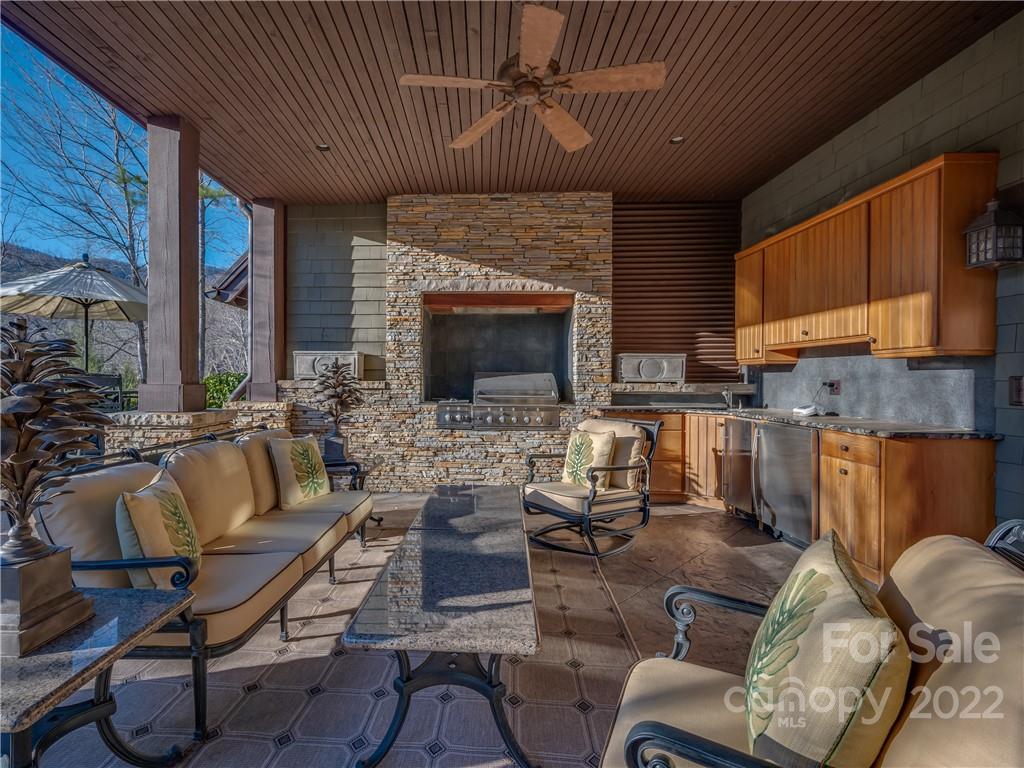 538 Chestertown Drive Mill Spring, NC 28756 - Photo 40 of 46 a living room with furniture fireplace and a fireplace