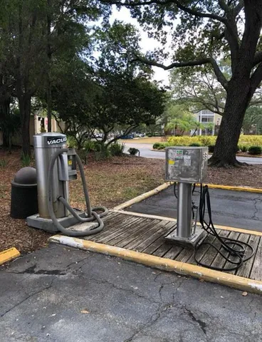 a view of a backyard with a large tree