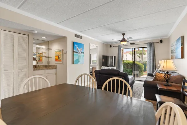 a view of a dining room with furniture window and outside view