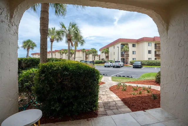 a view of a front of a house with a yard