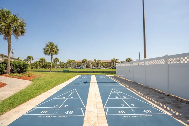 a view of a swimming pool with an outdoor seating