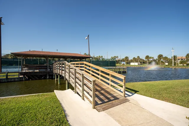 a view of swimming pool with outdoor seating and yard