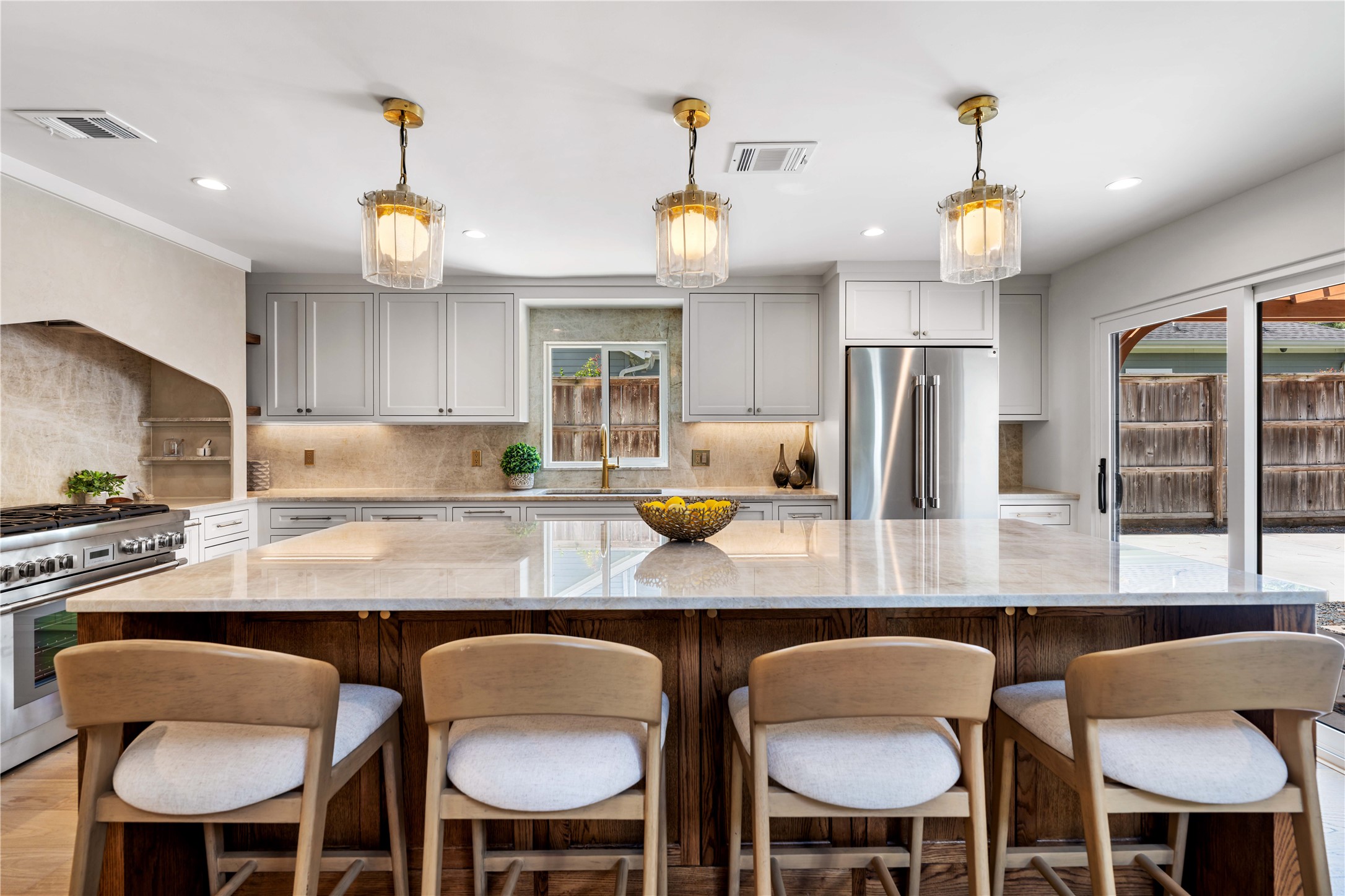 814 Azalea Street Houston, TX 77018 - Photo 6 of 25 a kitchen with a dining table chairs refrigerator and cabinets