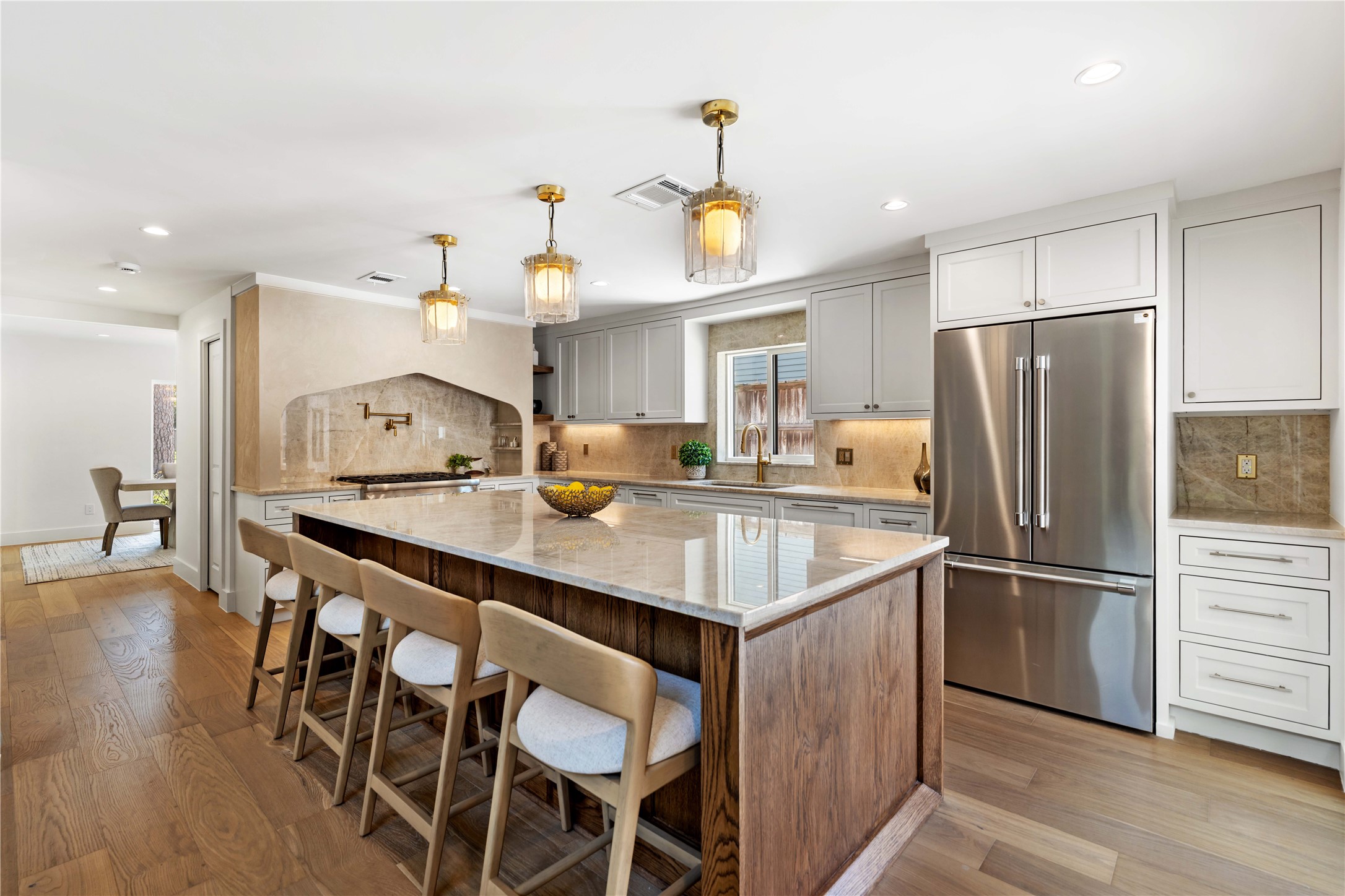 814 Azalea Street Houston, TX 77018 - Photo 7 of 25 a kitchen with kitchen island a sink stove and refrigerator