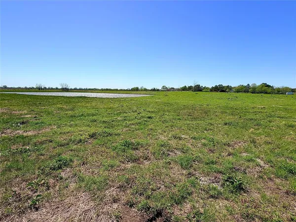 a view of a lake and a yard