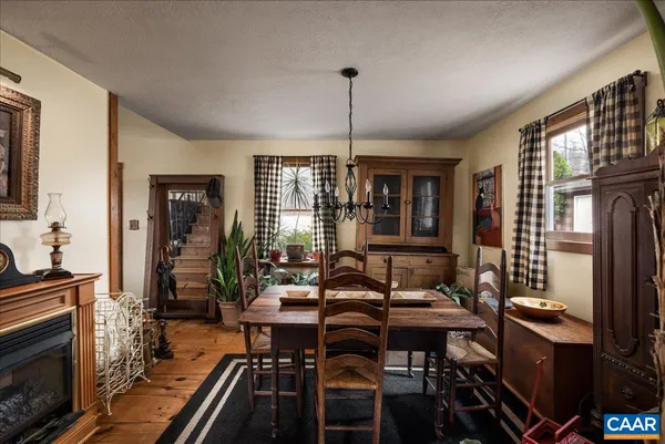 a bedroom with a large bed couch and a window