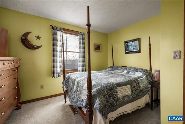 a bedroom with furniture and a window