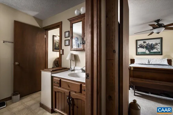 a view of a house with a tree and yard