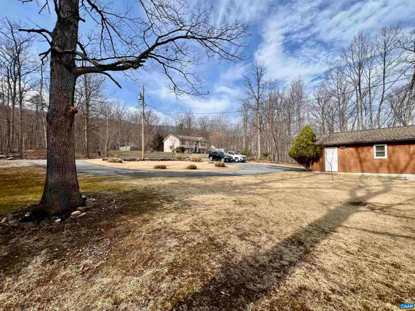 a view of a house with patio and a fire pit