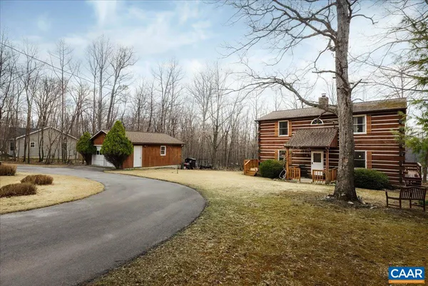 a view of a chairs setting in the backyard