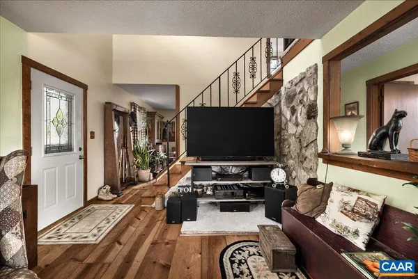 a living room with furniture and a flat screen tv
