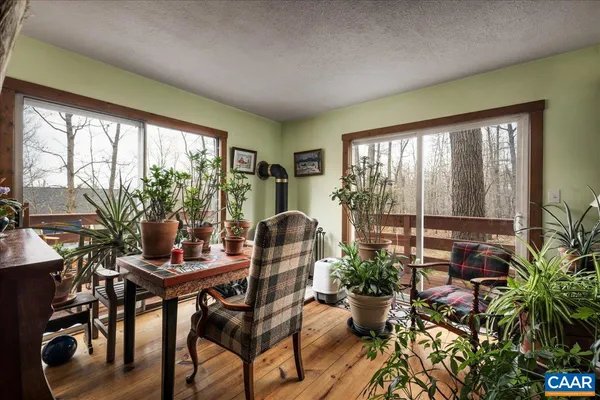 a workspace with furniture and a potted plant