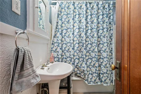 a bathroom with a sink and mirror