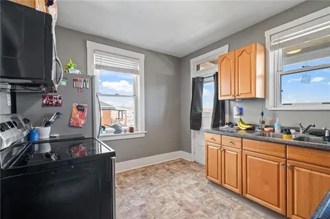 a kitchen with sink cabinets and window
