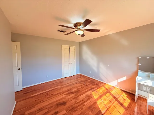 a view of a big room with wooden floor