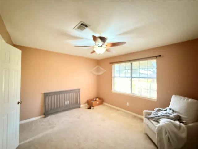 a bed room with a bed and a window