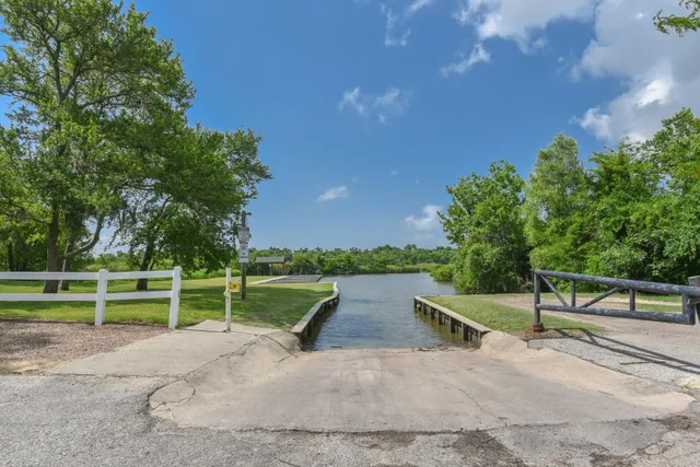 a view of park with bench in wooden floor