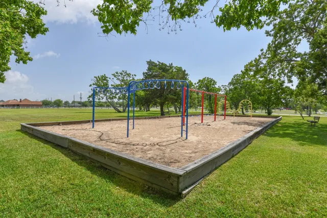 a view of a backyard with swimming pool