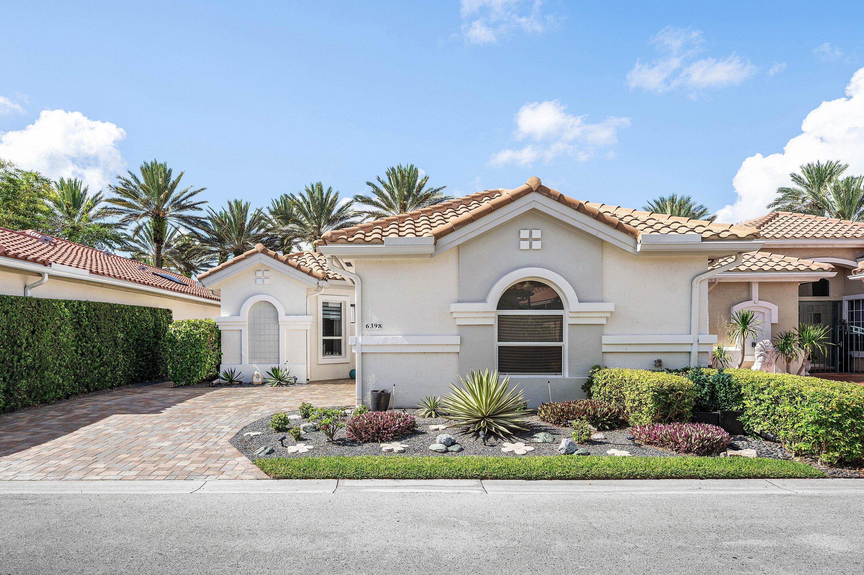 6398 Northwest 23rd Lane Boca Raton, FL 33434 - Photo 1 of 51 Lush Landscaping Entry