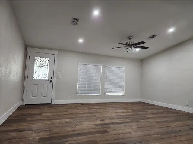 a bathroom with a toilet a sink a vanity and mirror