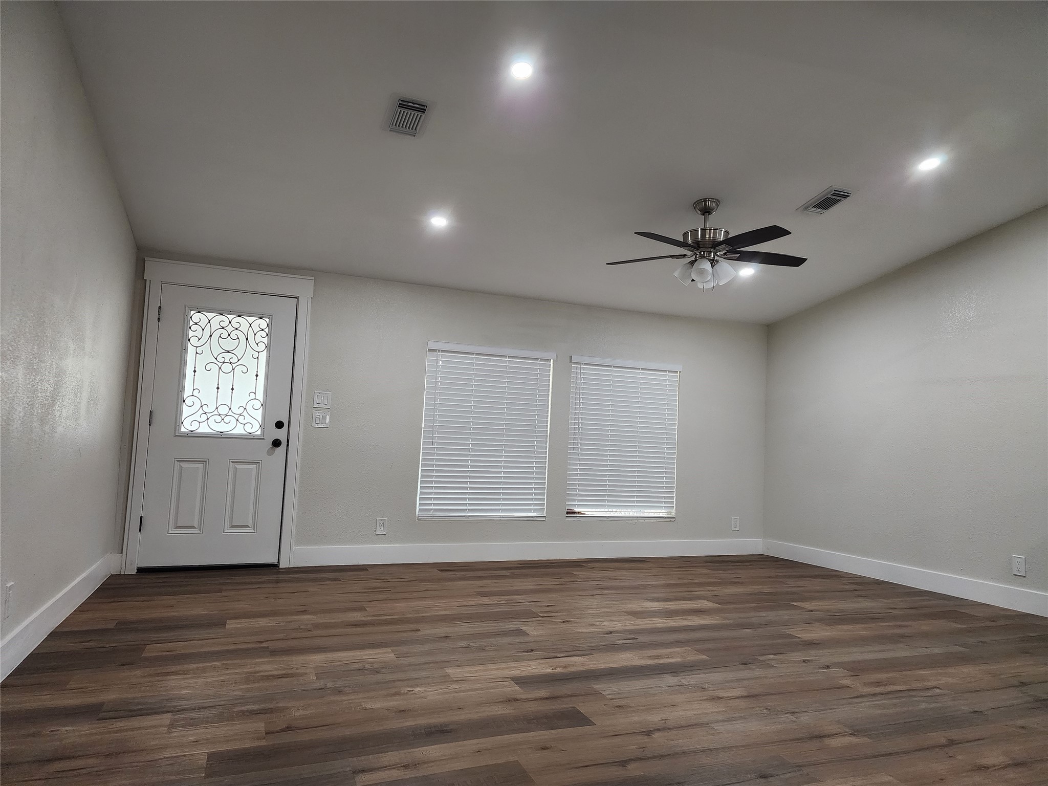 1491 Pecan Valley Road Wharton, TX 77488 - Photo 4 of 38 a view of an empty room with a window