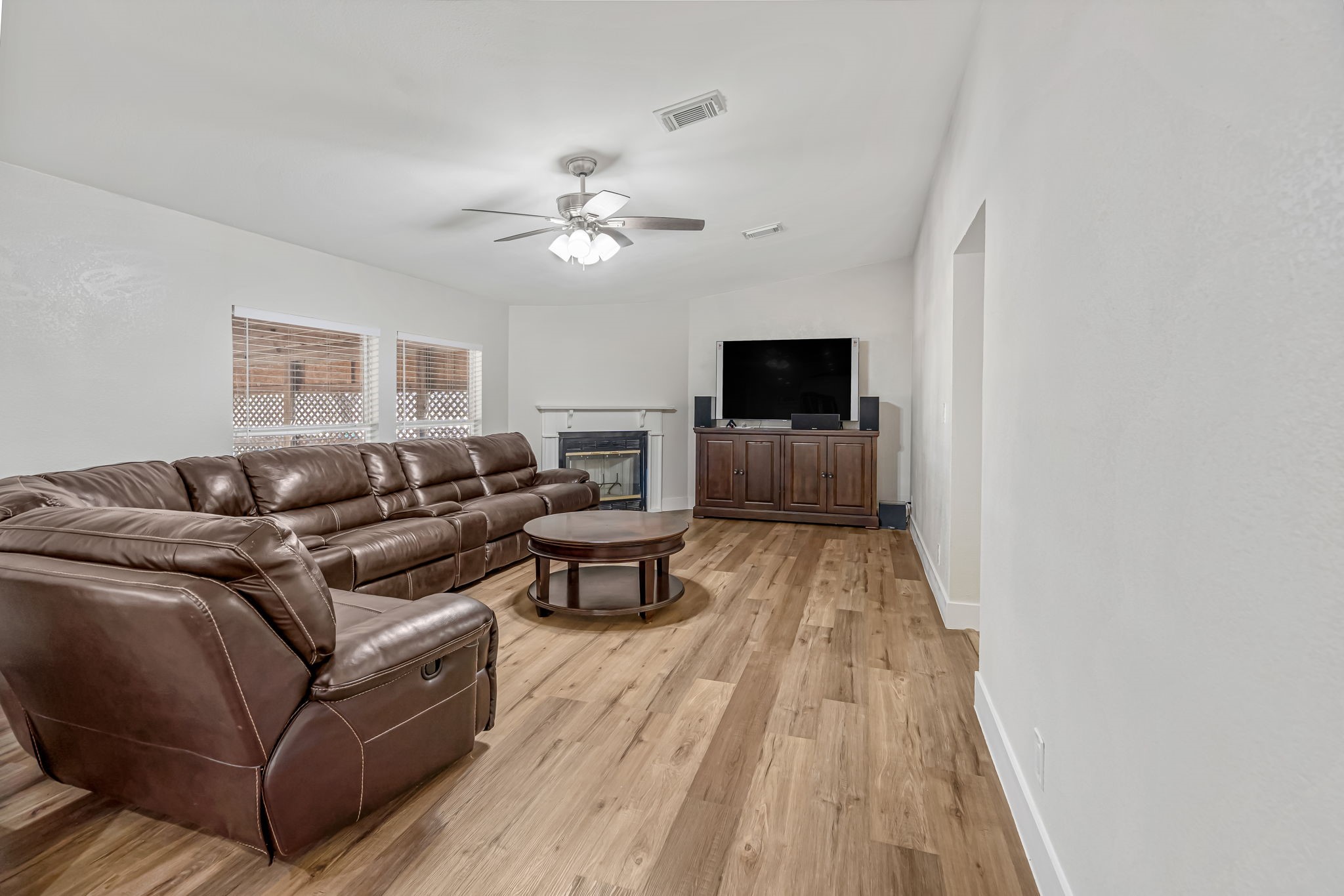 1491 Pecan Valley Road Wharton, TX 77488 - Photo 5 of 38 a living room with furniture and a flat screen tv