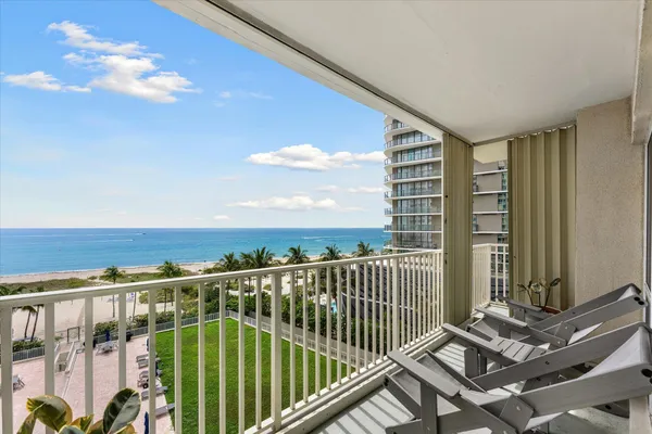 a view of balcony with furniture