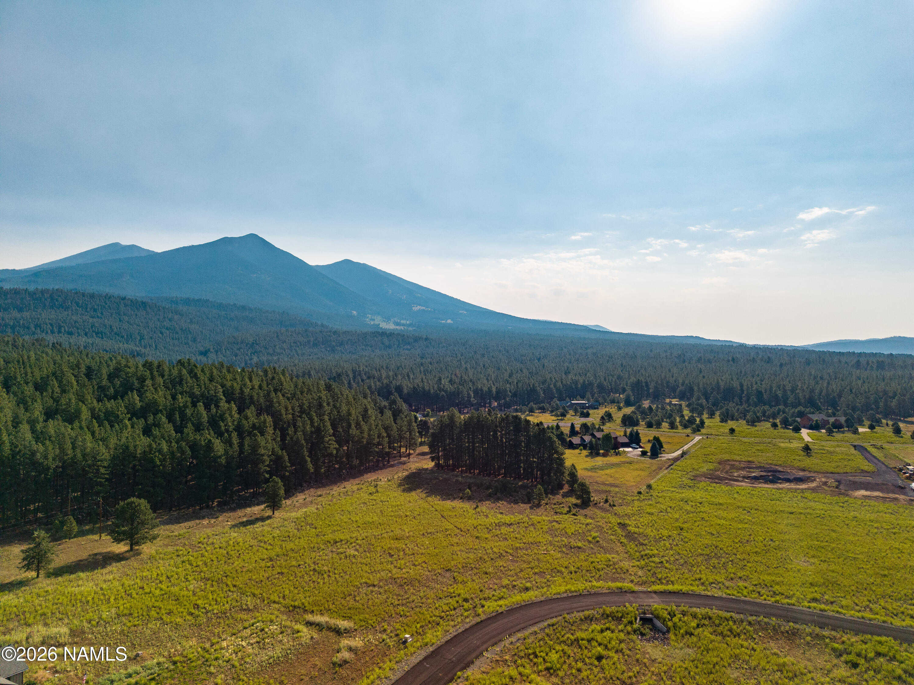 9199 Ranch At The Peaks Way Flagstaff, AZ 86001 - Photo 2 of 11 a view of a lake with mountain