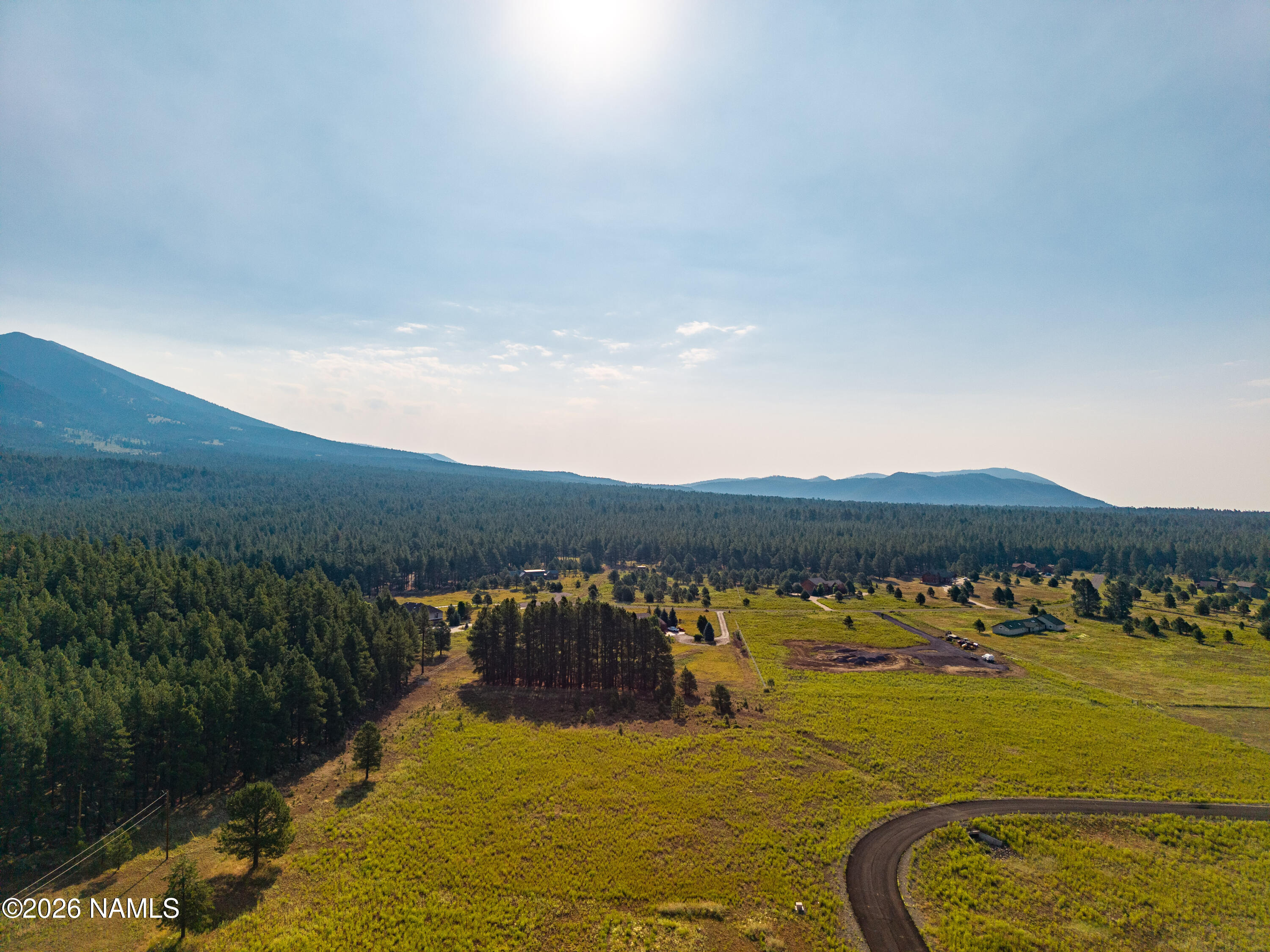 9199 Ranch At The Peaks Way Flagstaff, AZ 86001 - Photo 3 of 11 a view of an ocean with mountains in the background