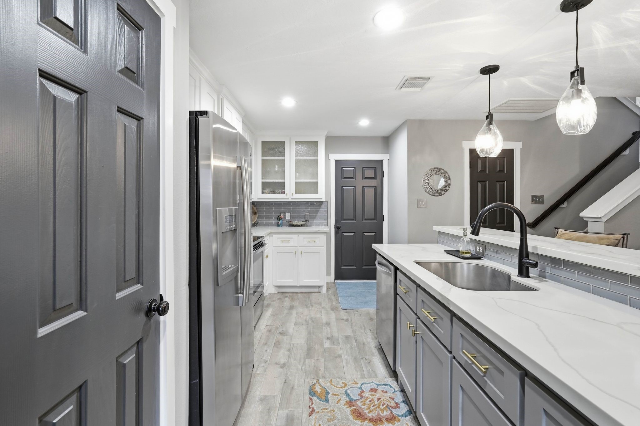 51 Wineberry Place Spring, TX 77382 - Photo 11 of 45 a kitchen with stainless steel appliances granite countertop a sink refrigerator and cabinets