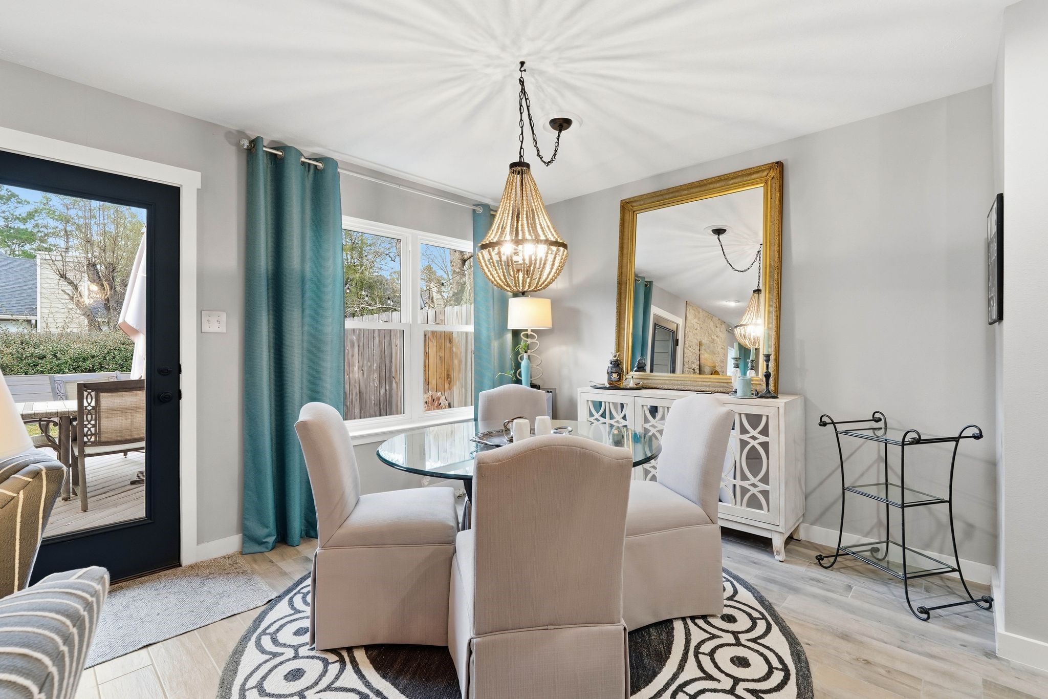 51 Wineberry Place Spring, TX 77382 - Photo 13 of 45 a living room with furniture a window and a chandelier