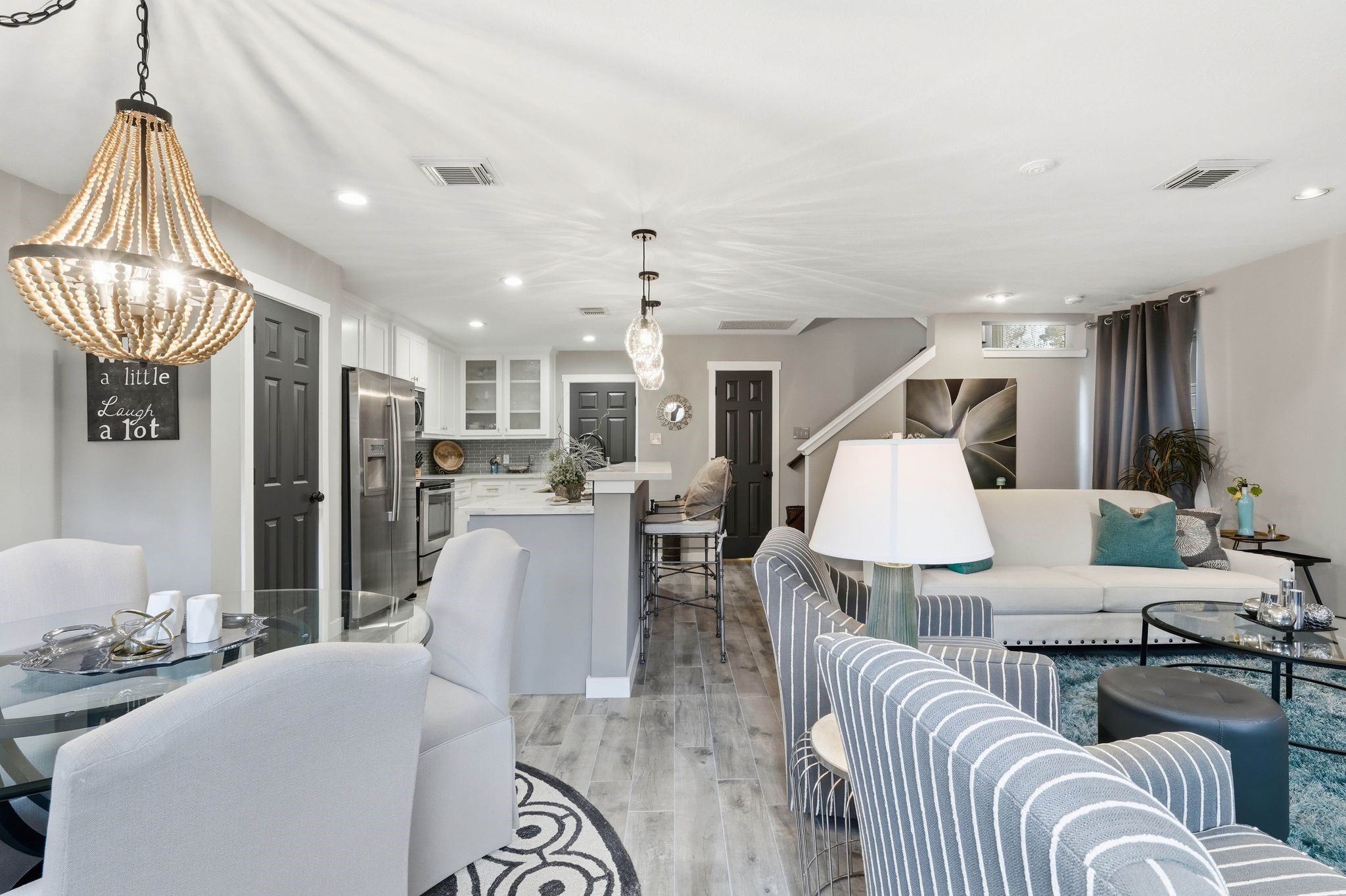 51 Wineberry Place Spring, TX 77382 - Photo 14 of 45 a living room with furniture and a chandelier