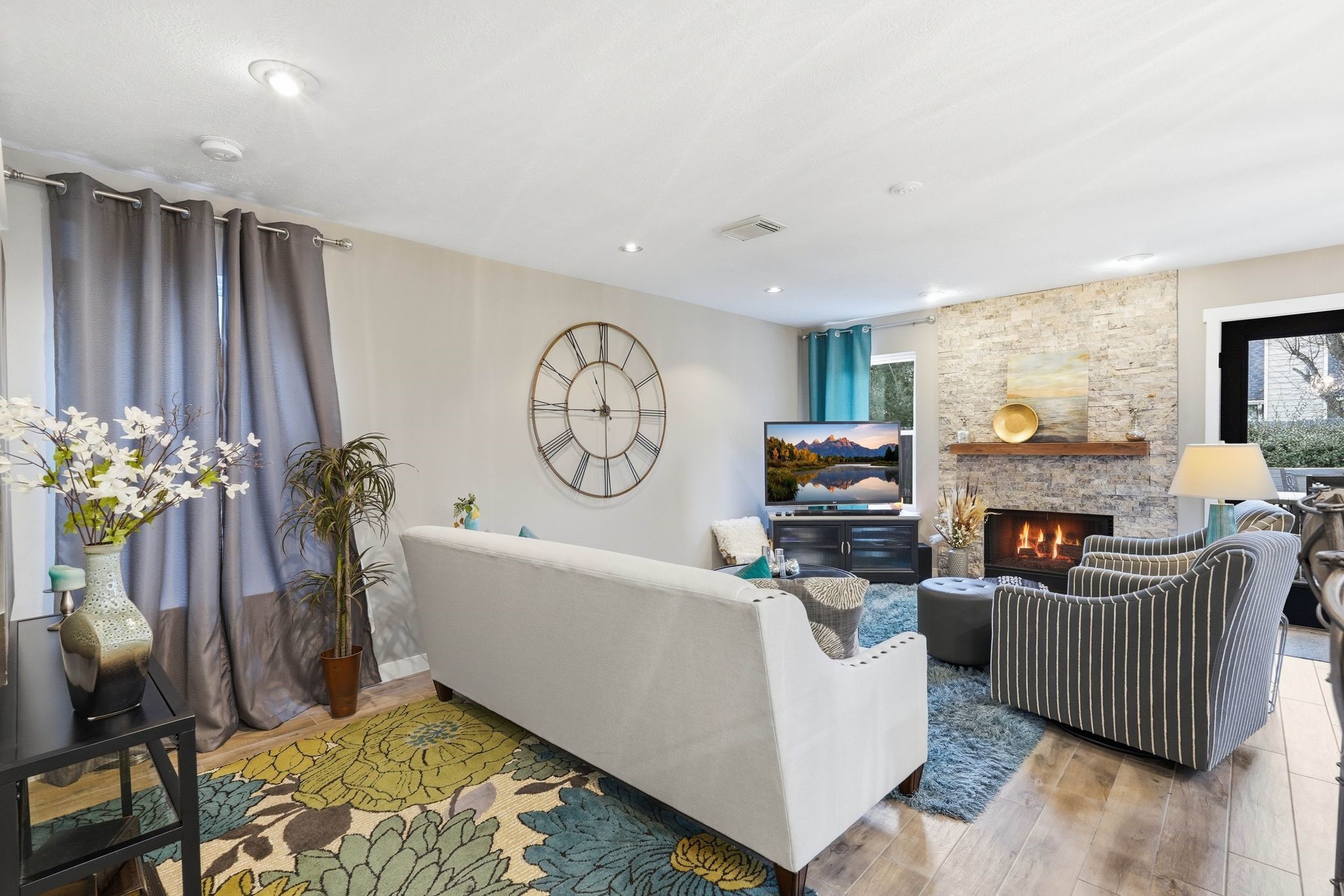 51 Wineberry Place Spring, TX 77382 - Photo 15 of 45 a living room with furniture a fireplace and a flat screen tv