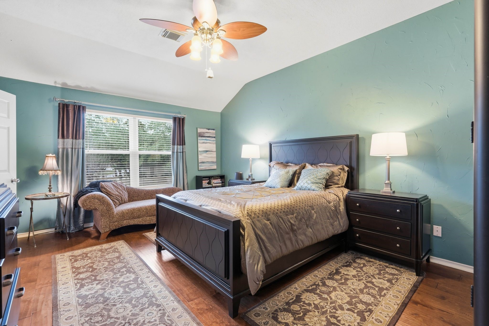 51 Wineberry Place Spring, TX 77382 - Photo 20 of 45 a bedroom with a bed and a chandelier