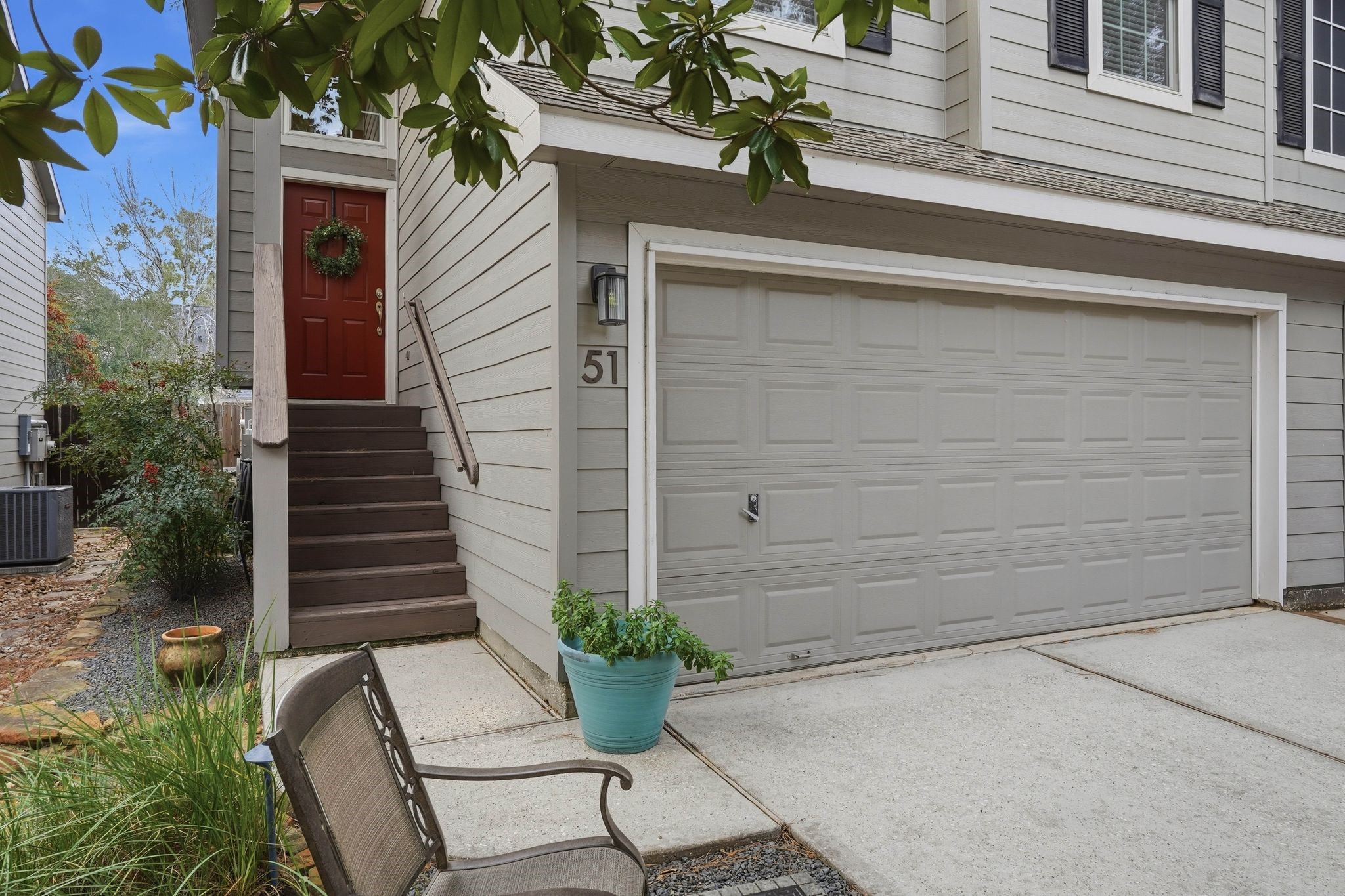 51 Wineberry Place Spring, TX 77382 - Photo 2 of 45 a potted plant sitting in front of a house