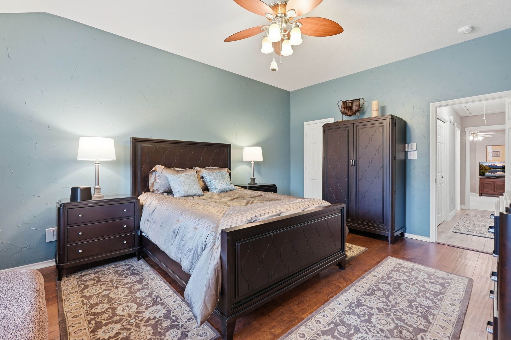 51 Wineberry Place Spring, TX 77382 - Photo 21 of 45 a bedroom with a bed and a chandelier