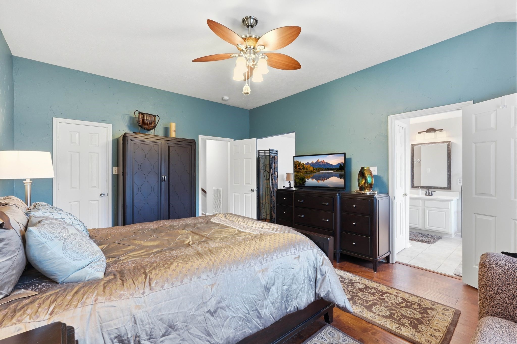 51 Wineberry Place Spring, TX 77382 - Photo 22 of 45 a bedroom with a bed and wooden floor