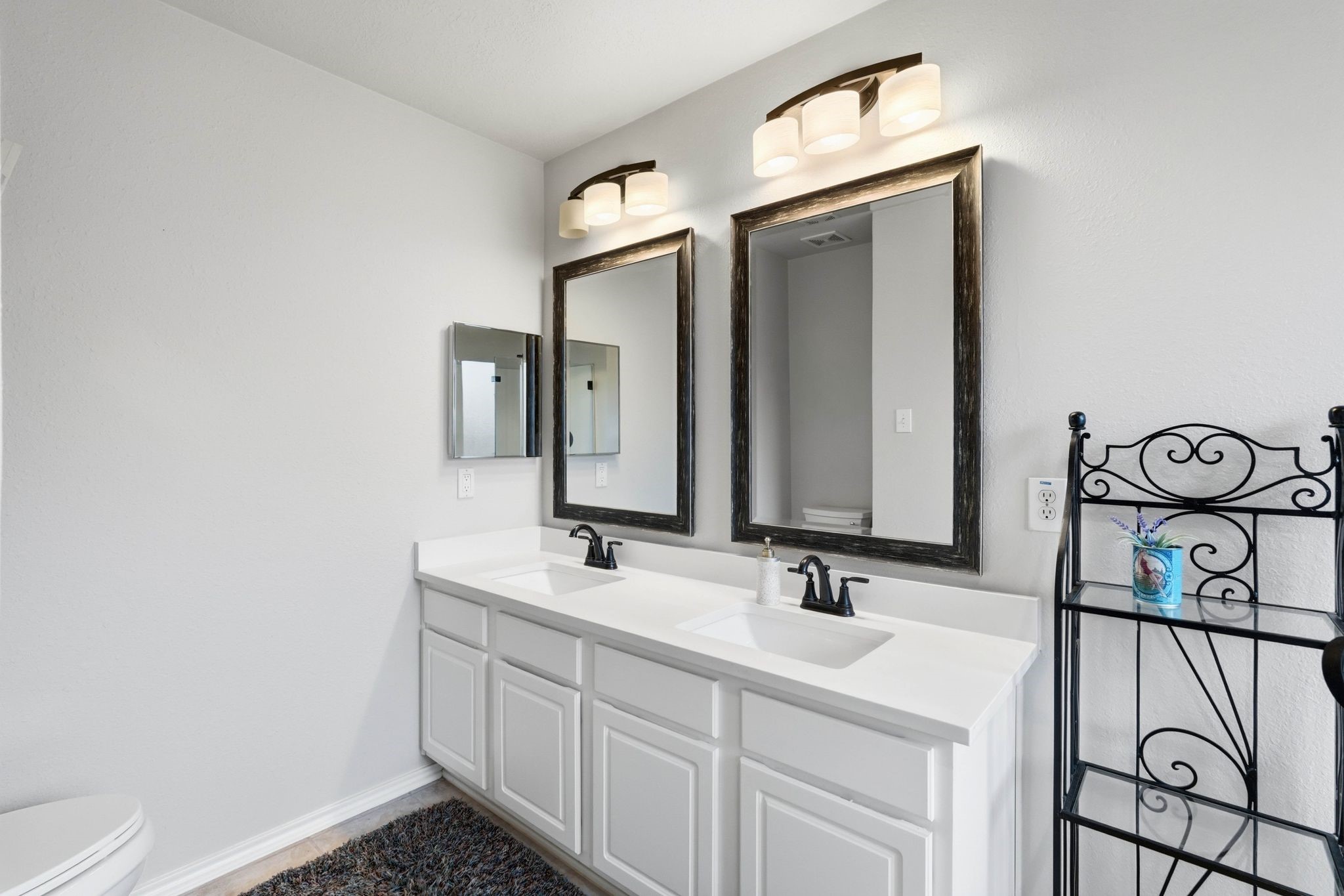 51 Wineberry Place Spring, TX 77382 - Photo 25 of 45 a bathroom with a sink and a mirror