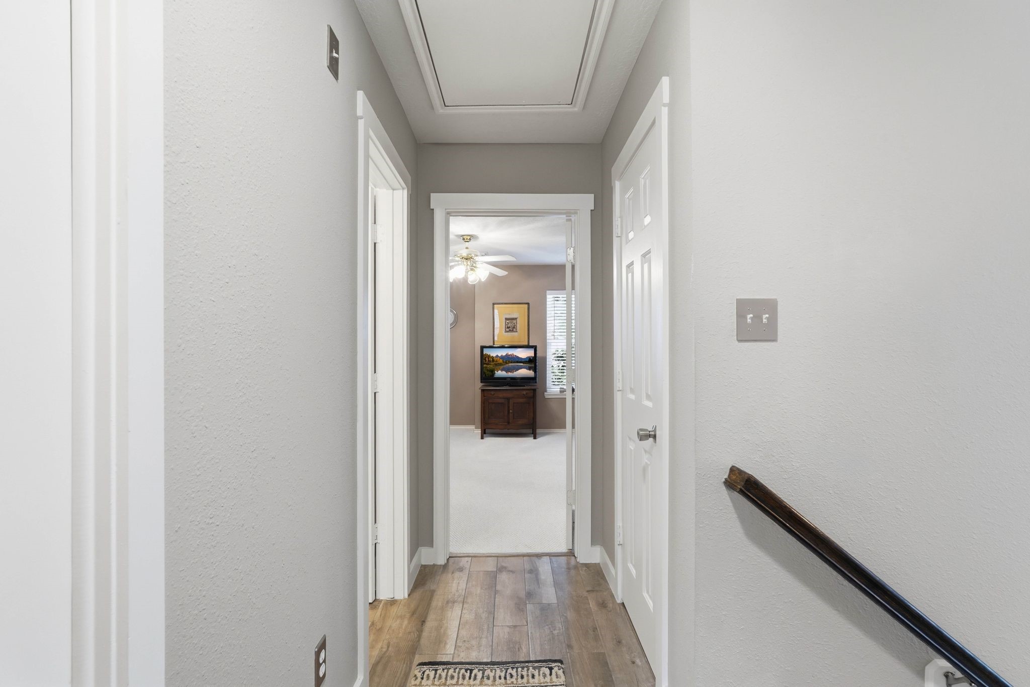 51 Wineberry Place Spring, TX 77382 - Photo 27 of 45 a view of a hallway with wooden floor and staircase