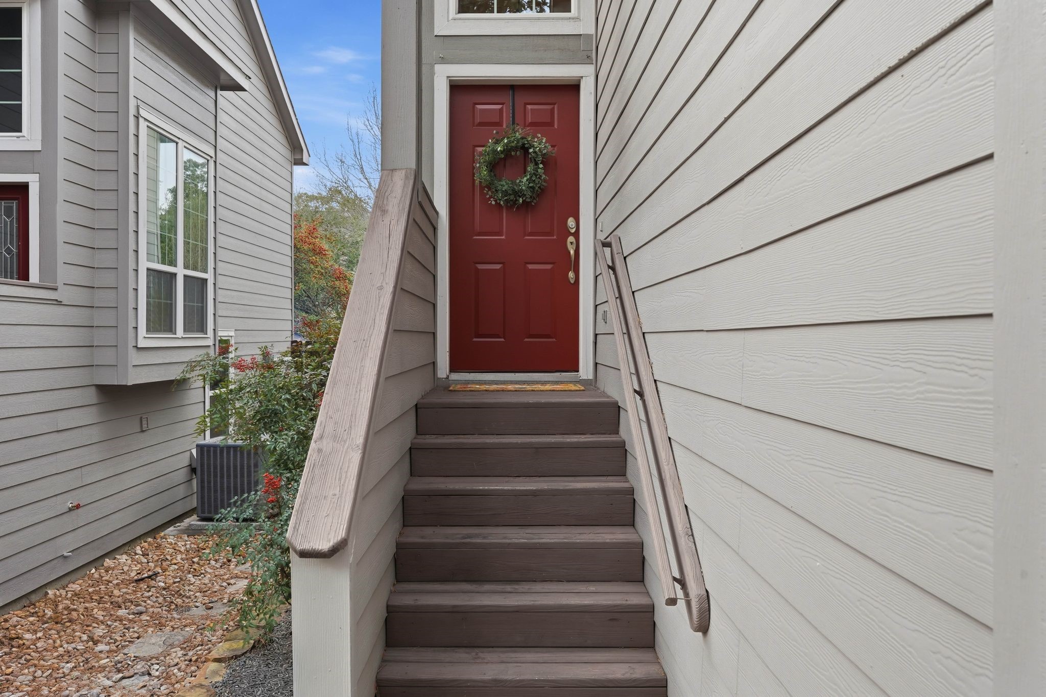 51 Wineberry Place Spring, TX 77382 - Photo 3 of 45 a view of staircase with wooden floor and a wall painting