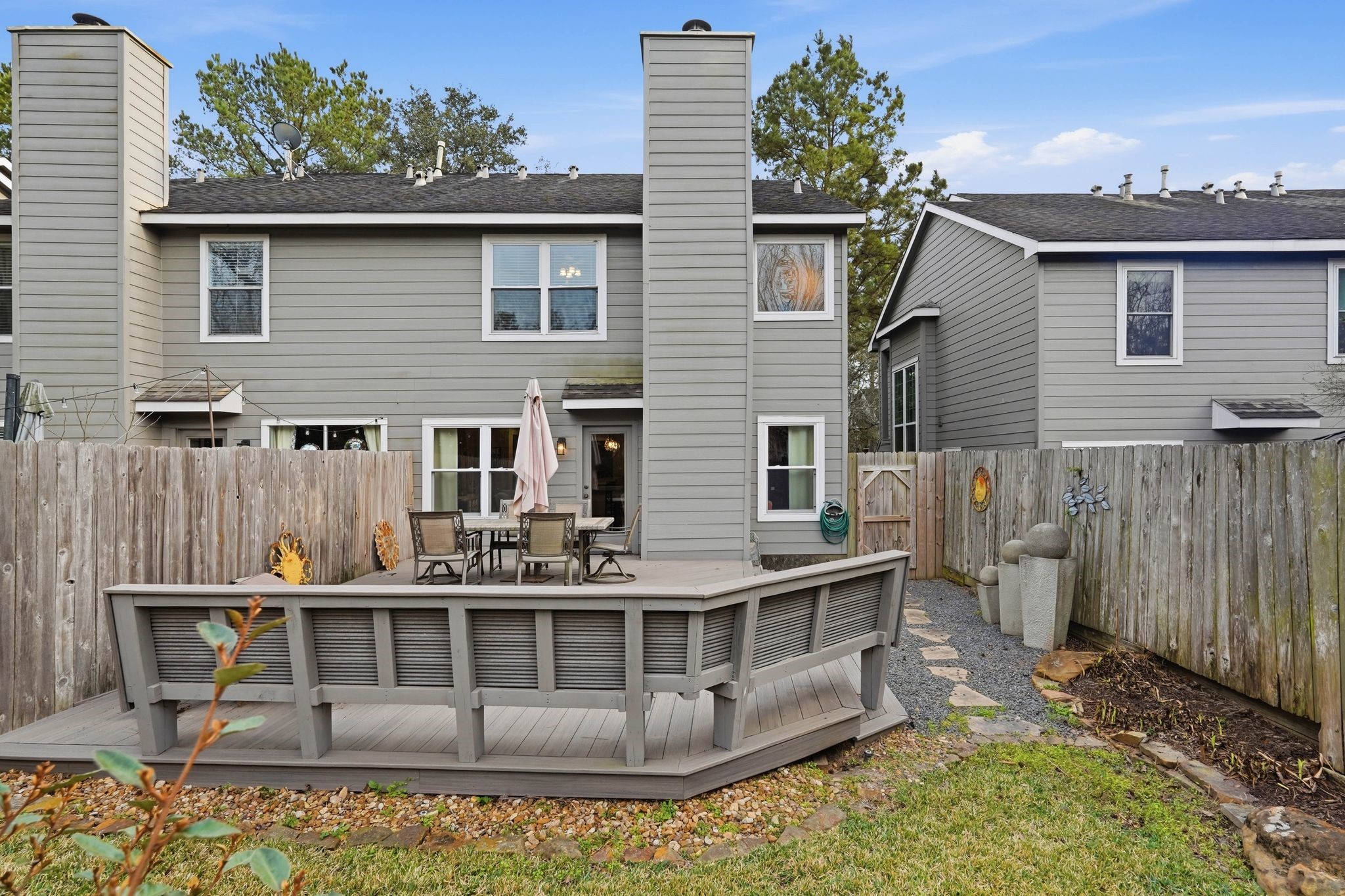 51 Wineberry Place Spring, TX 77382 - Photo 36 of 45 a view of a house with wooden deck and furniture