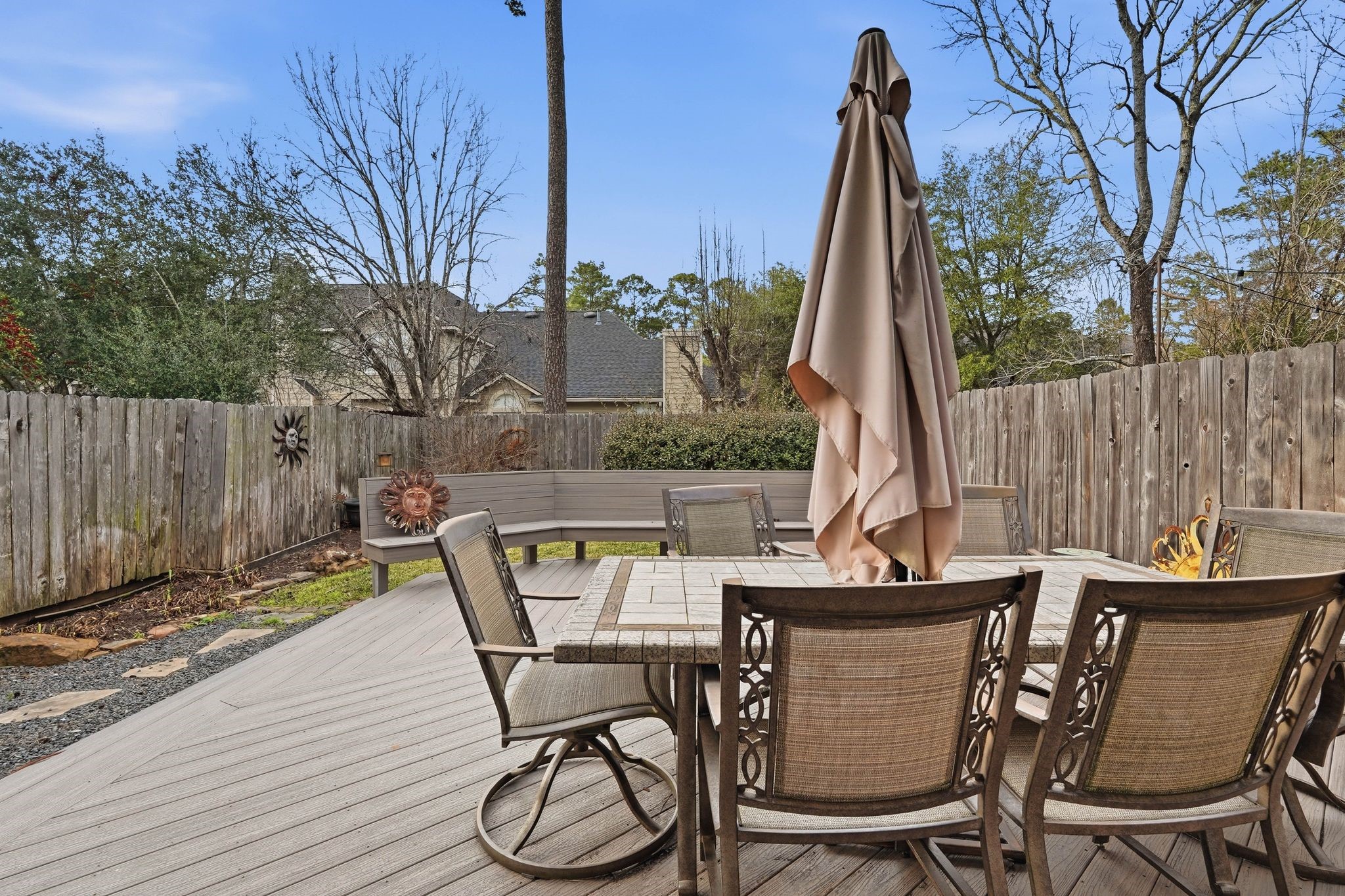 51 Wineberry Place Spring, TX 77382 - Photo 37 of 45 a view of backyard with a table and chairs