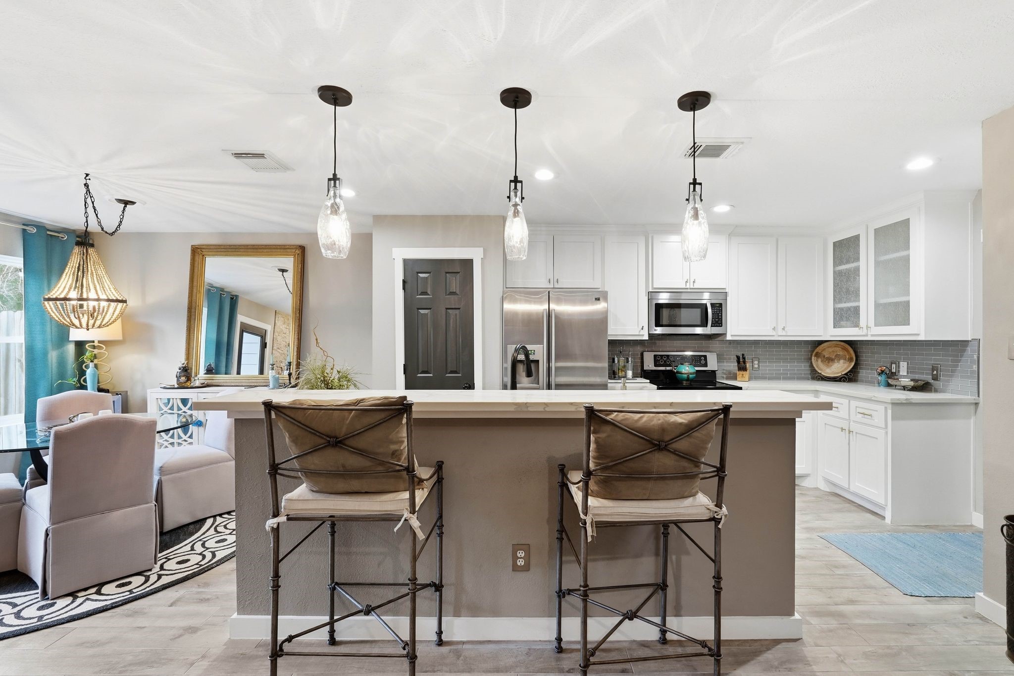 51 Wineberry Place Spring, TX 77382 - Photo 8 of 45 a kitchen with stainless steel appliances kitchen island a table and chairs in it